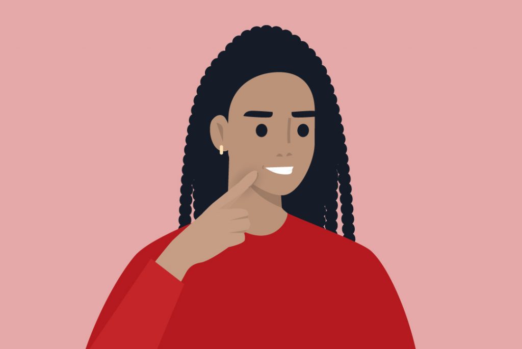 person pointing to beautiful, healthy smile