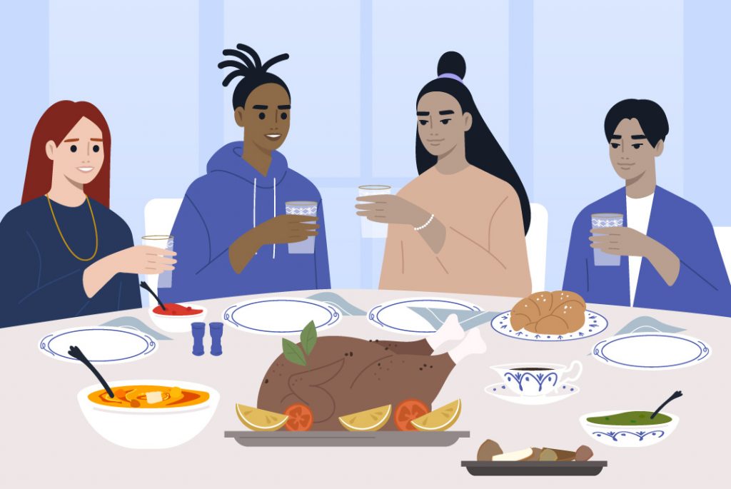 loved ones gathered around a thanksgiving table