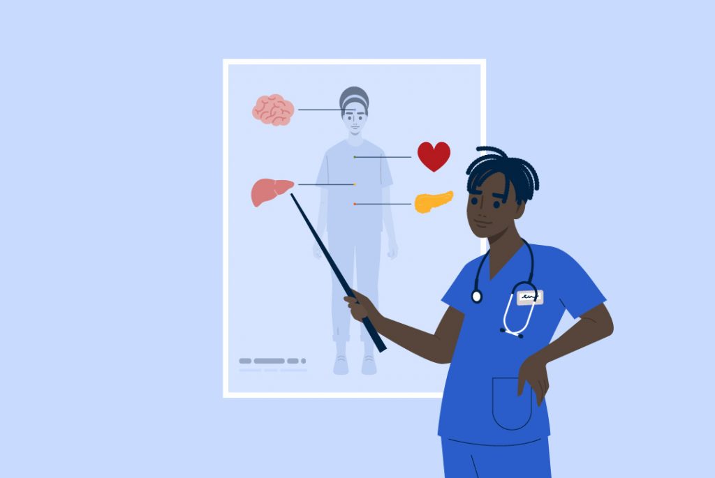 health care worker pointing to illustration of human anatomy