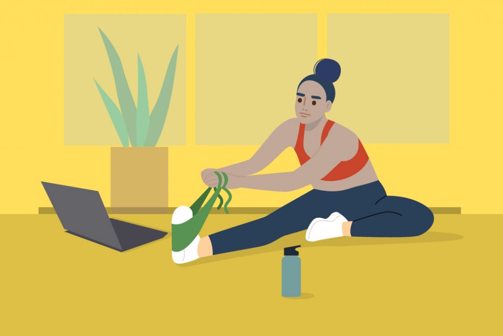 person stretching in front of laptop