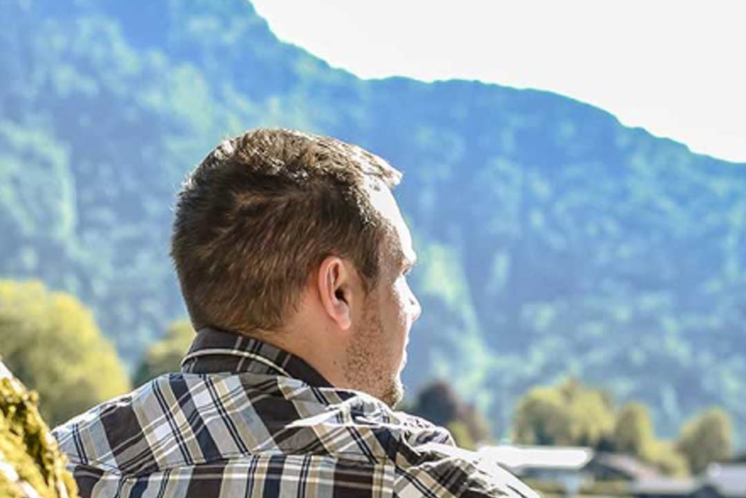person looking off into the distance of nature